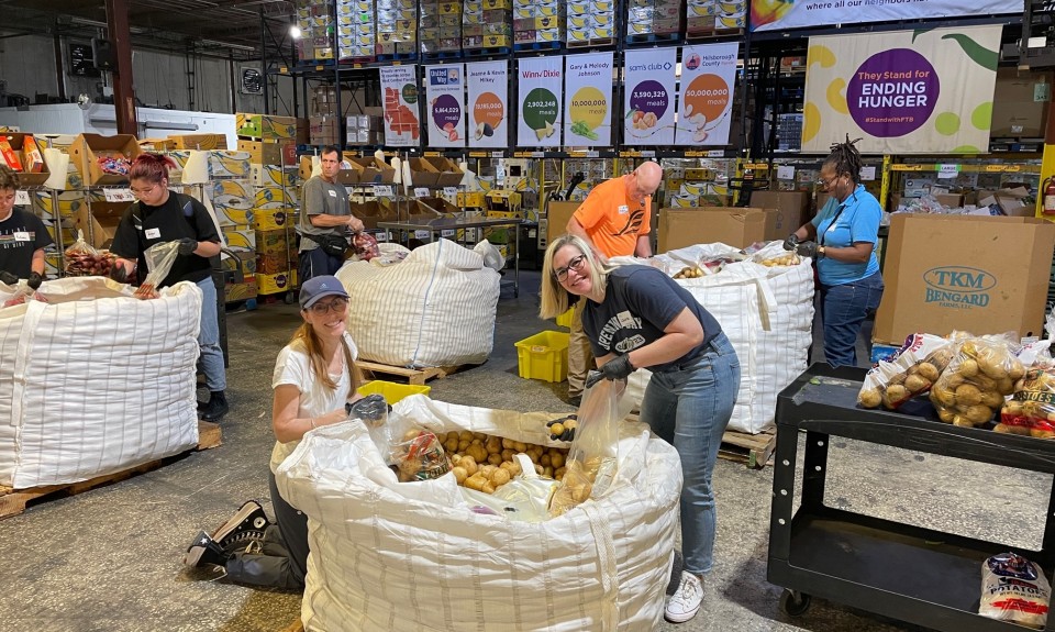 Volunteers packing potatoes at Feeding Tampa Bay