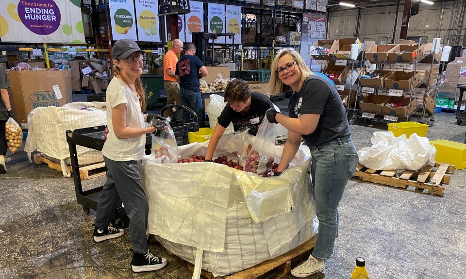 Volunteers packing potatoes at Feeding Tampa Bay