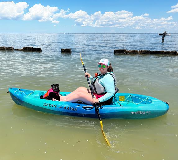 Ashley and her Pug kayaking