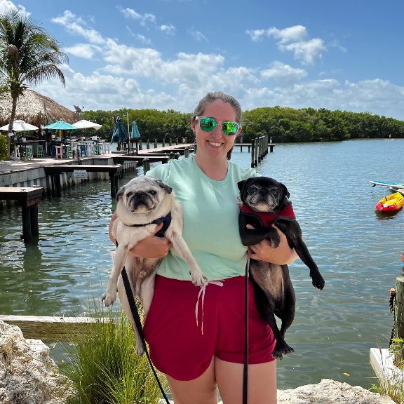 Ashley holding her pugs