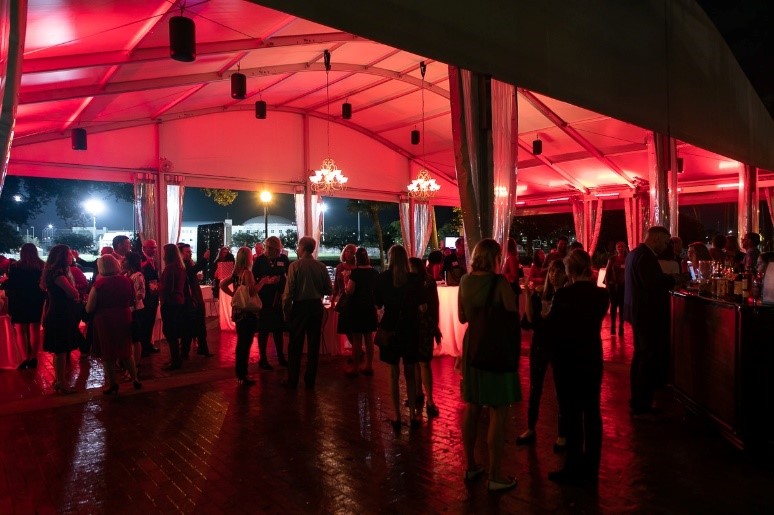 Members and guests enjoy the mixer at a tent outside the Straz Center.