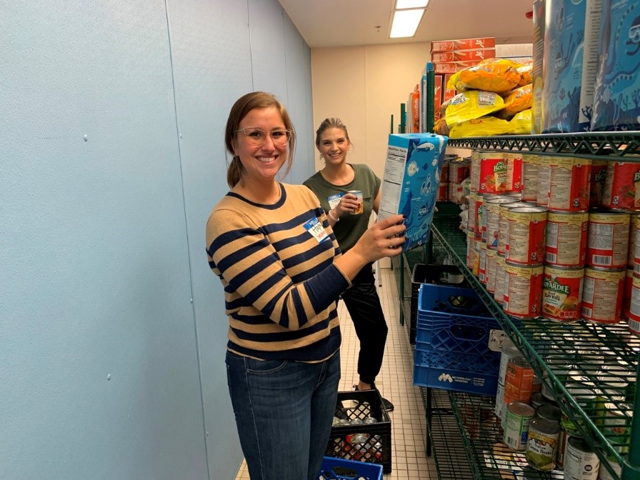 People stocking shelves at Feeding Tampa Bay facility