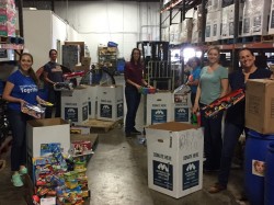 Volunteers loading boxes in Feeding Tampa Bay warehouse